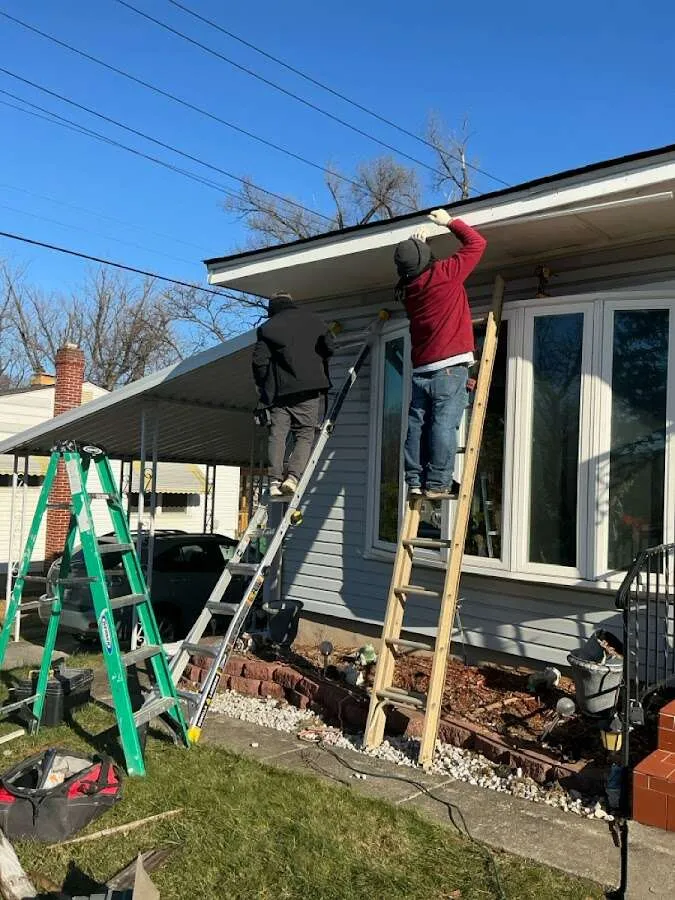 Restoration crew performing exterior repair in Forestdale